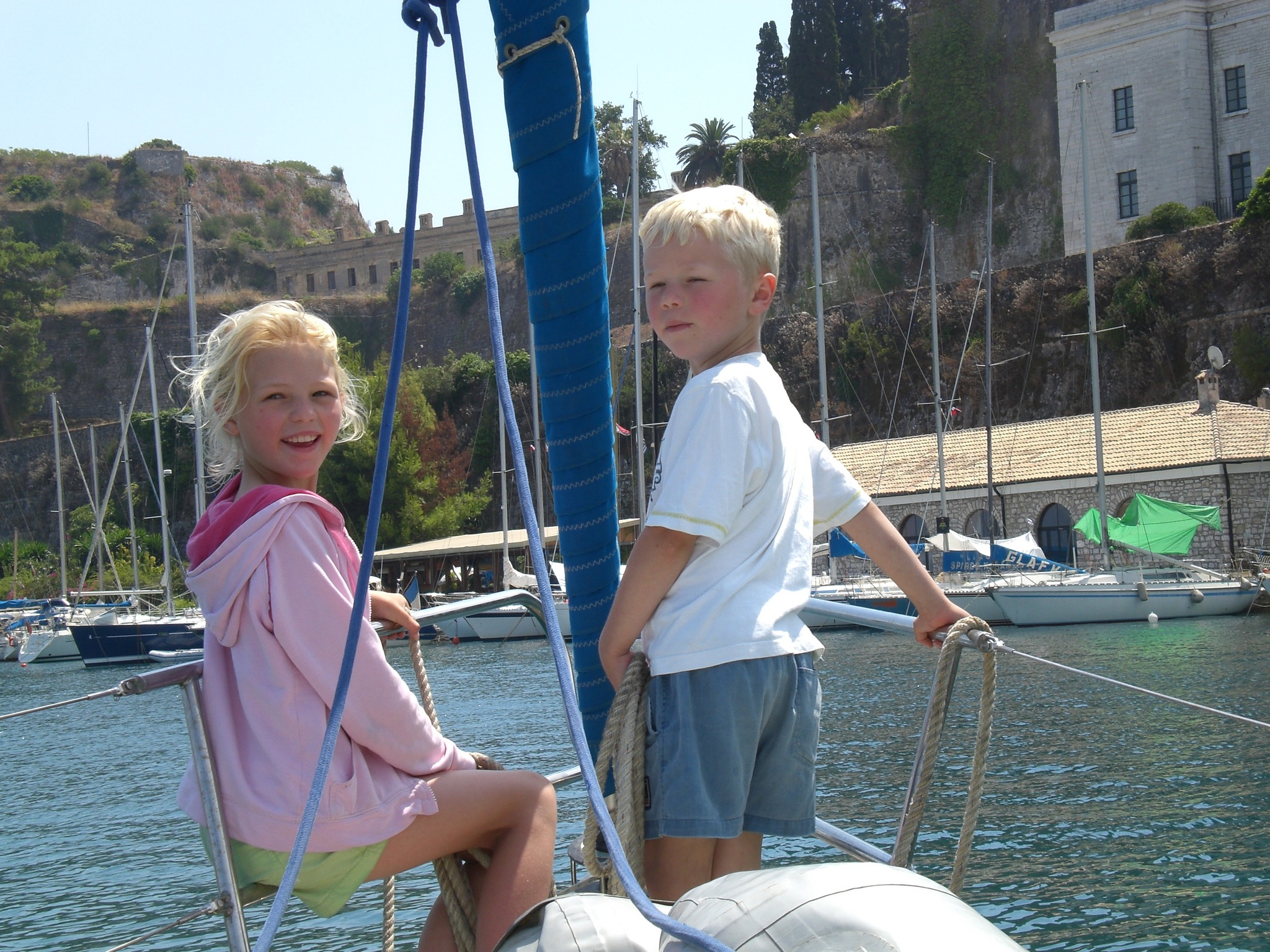 Mark and Sacha as children on a sailboat in Corfu.